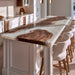 Contemporary black walnut epoxy island top with pearl white resin and a waterfall edge