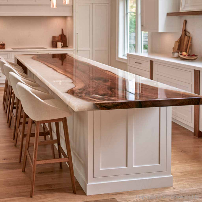 Modern kitchen with a black walnut epoxy island top featuring pearl white resin and pendant lighting