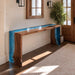 Close up of blue and white ocean wave epoxy resin flowing alongside natural black walnut grain