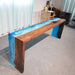 Ocean wave epoxy console table in a coastal entryway with a decorative mirror and neutral accents