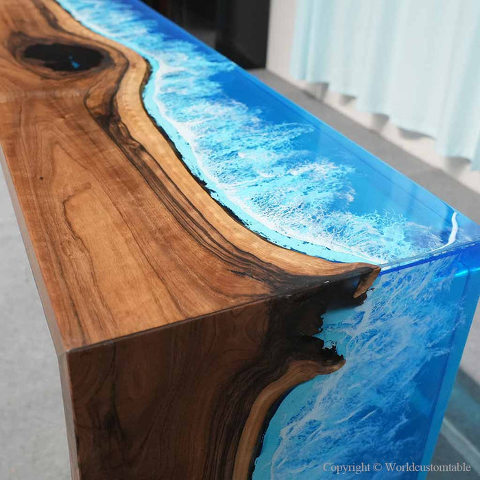 Luxury foyer featuring a black walnut waterfall console table with blue and white ocean wave resin