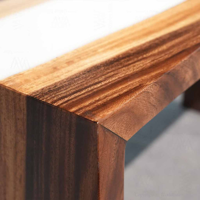 Waterfall edge design showing white epoxy resin flowing alongside black walnut on a console table