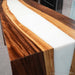 Luxury foyer featuring a black walnut waterfall console table with elegant white epoxy resin