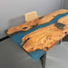 Wooden desk with blue resin inlay on a gray background