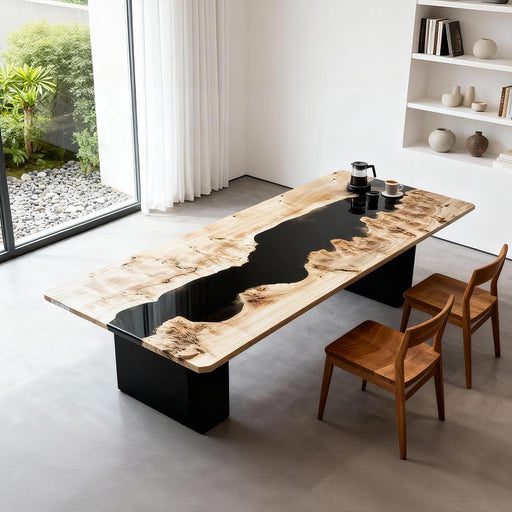 Modern dining table with black resin inlay in a minimalistic room.