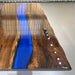 Large rectangular black walnut and blue resin table suitable for luxury dining or executive conference rooms.