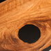 Close-up of a wooden surface with a central hole