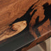 Close-up of a wooden surface with black resin inlay