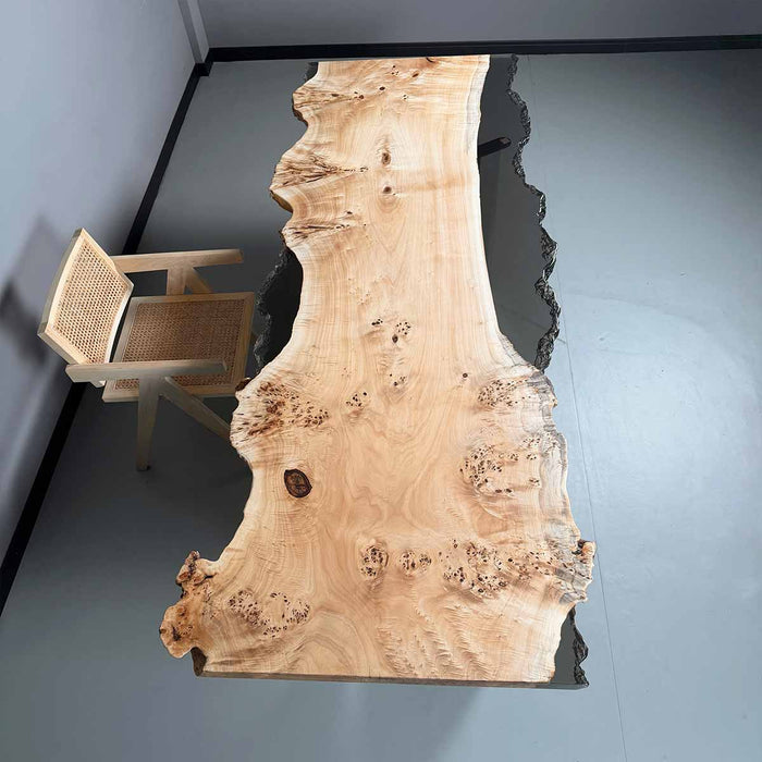 Wooden dining table with a chair in a minimalistic room