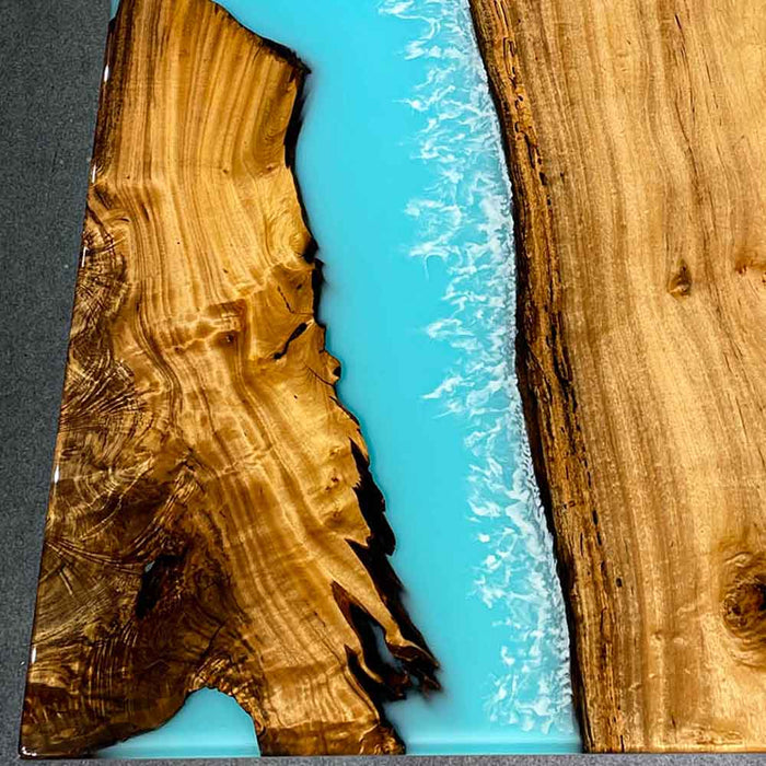 Ready-to-ship 47×80 Golden Camphor light blue epoxy resin dining table for 8 guests.