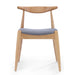Wooden chair with a blue cushion on a white background