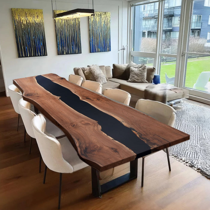 Dining room with a wooden table and chairs, featuring abstract wall art.