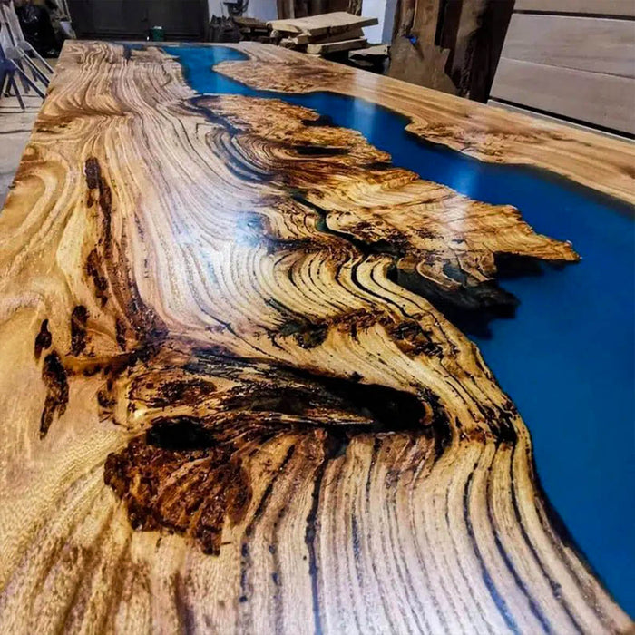 Wooden table with blue resin inlay