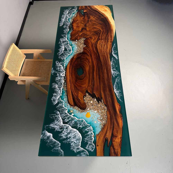 Table with a unique design featuring wood and ocean wave patterns on a white floor.