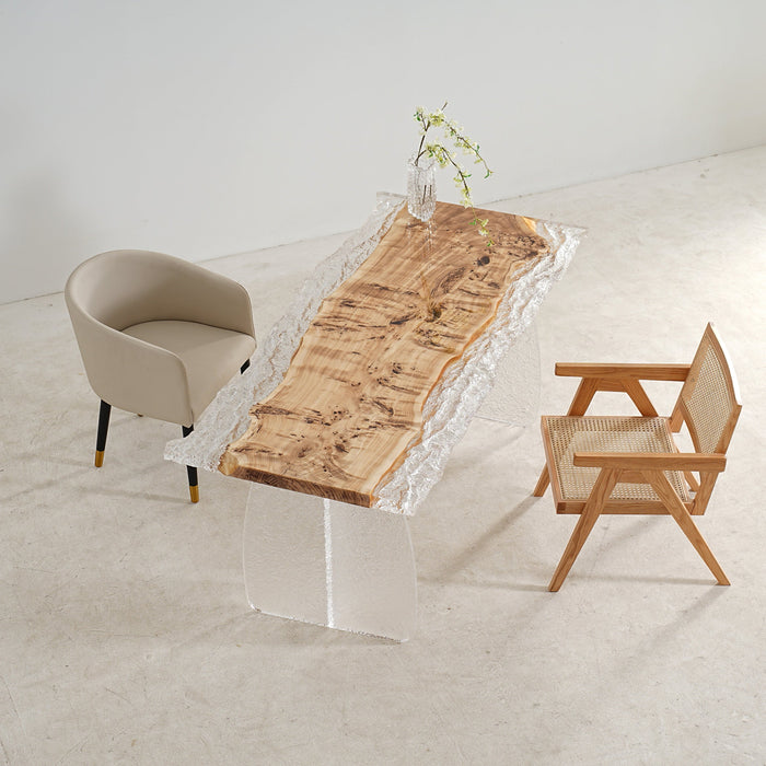 Close-up of glossy epoxy dining table showing wood grain beneath glass-like resin.