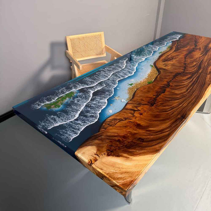 Wooden table with a scenic design of waves and land, placed against a plain wall.