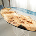 Side view of live edge poplar wood dining table with ocean resin centerpiece