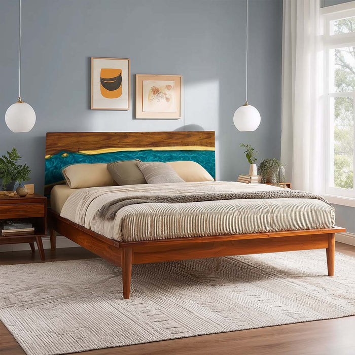 Wooden bed in a bedroom with teal headboard and bedding