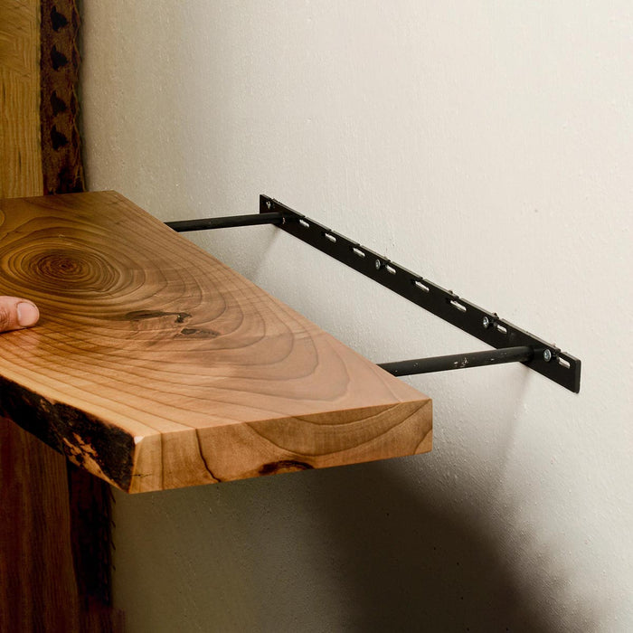 Wooden shelf attached to a wall with a metal bracket