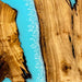 Detailed view of the live edge craftsmanship and smooth epoxy resin finish.