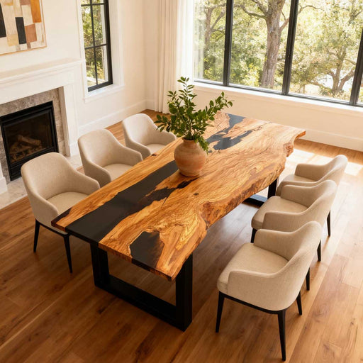 Dining room with a wooden table and chairs near a fireplace and large windows.