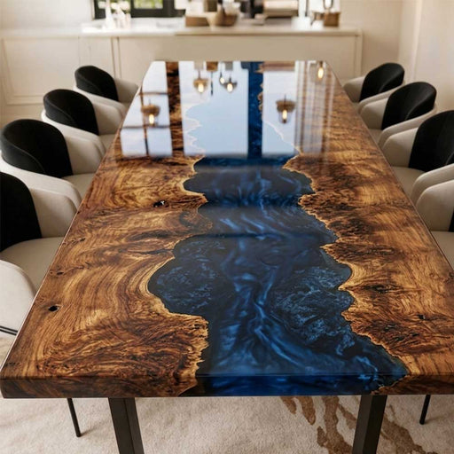 Close-up of natural poplar burl grain with transparent blue epoxy resin river.
