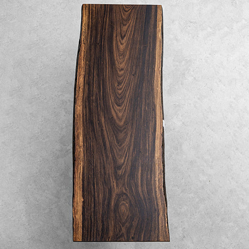 Live edge dining table made from a single century-old South American rain tree slab, organic and bold.