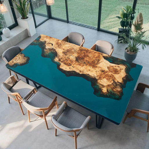 Custom live edge dining table with blue resin river and burl wood
