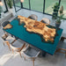Custom live edge dining table with blue resin river and burl wood