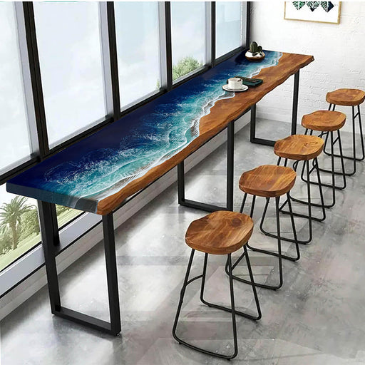 Custom resin wood counter-height bar table with stools, blending ocean-inspired blue tones and natural grain.