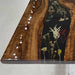 Elegant live edge walnut table with artistic resin river and warm natural lighting atmosphere