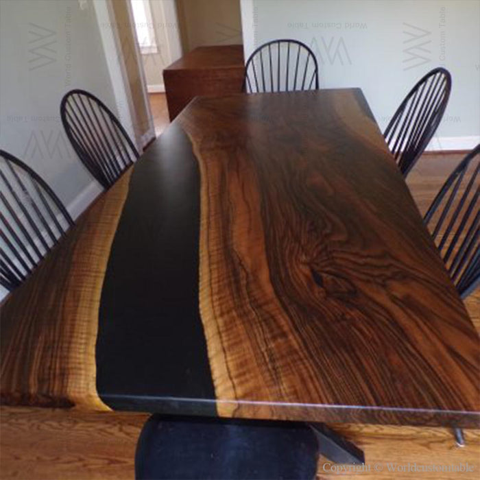 Live edge walnut dining table featuring a sleek black epoxy resin, made in the USA.
