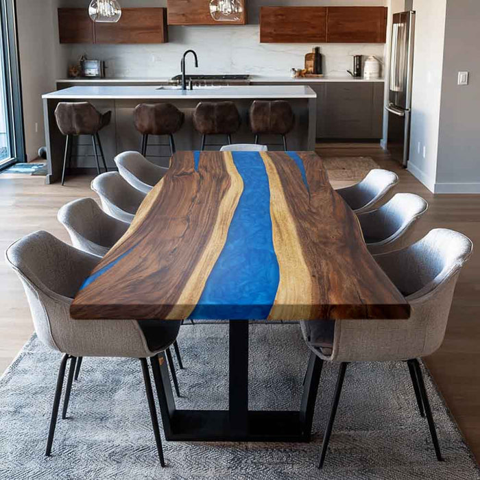 Dining room with a wooden table featuring a blue resin river design, surrounded by chairs.