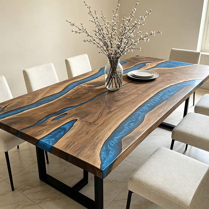 Modern dining room featuring a live edge walnut epoxy river table with elegant minimalist decor.