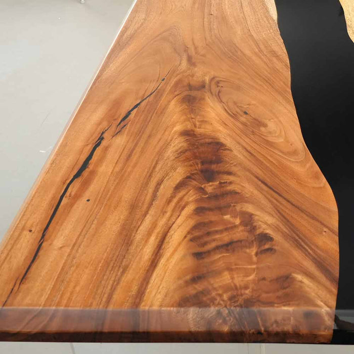 Detailed view of the live edge craftsmanship and smooth resin finish.
