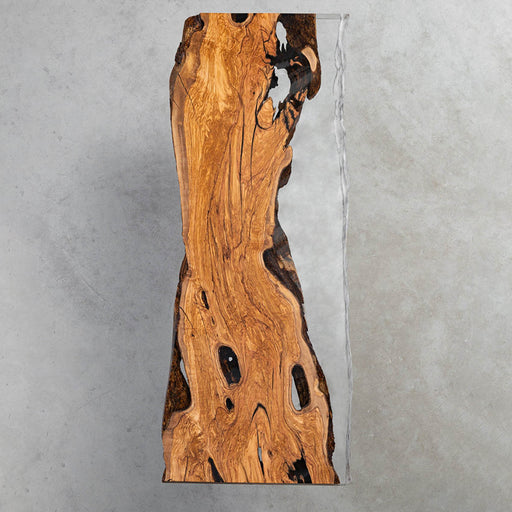 Exquisite live edge wood slab dining table featuring crystal-clear epoxy resin, showcasing natural wood textures and modern craftsmanship for luxury interiors.