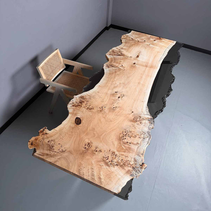 Wooden dining table with a natural finish in a minimalistic room.