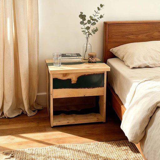 Luxury black epoxy bedside table showcasing natural ash wood grain.