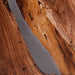 Black walnut epoxy resin conference table styled in a modern boardroom.