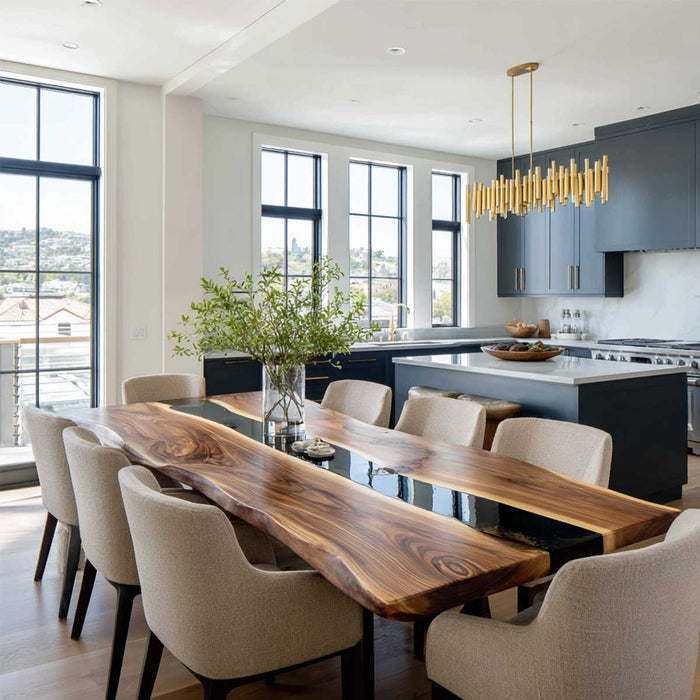 Modern kitchen with a long wooden dining table and chairs, featuring a large window view.