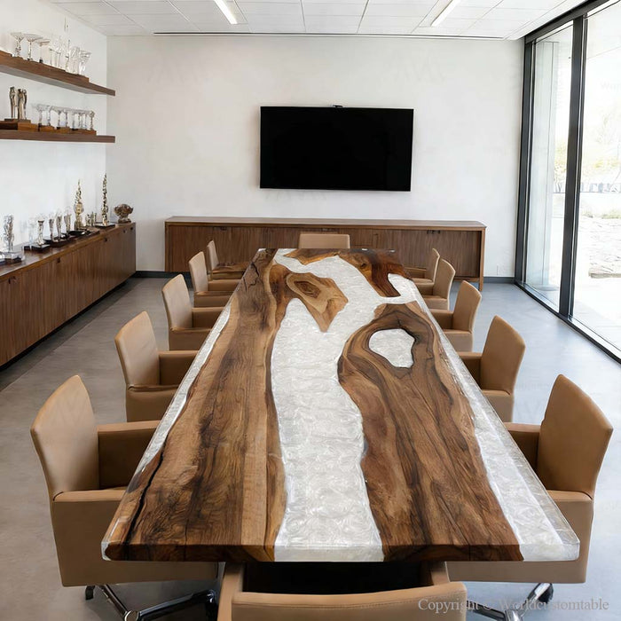 Luxury black walnut dining table with white swirl epoxy resin in a modern Los Angeles home.