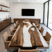Luxury black walnut dining table with white swirl epoxy resin in a modern Los Angeles home.