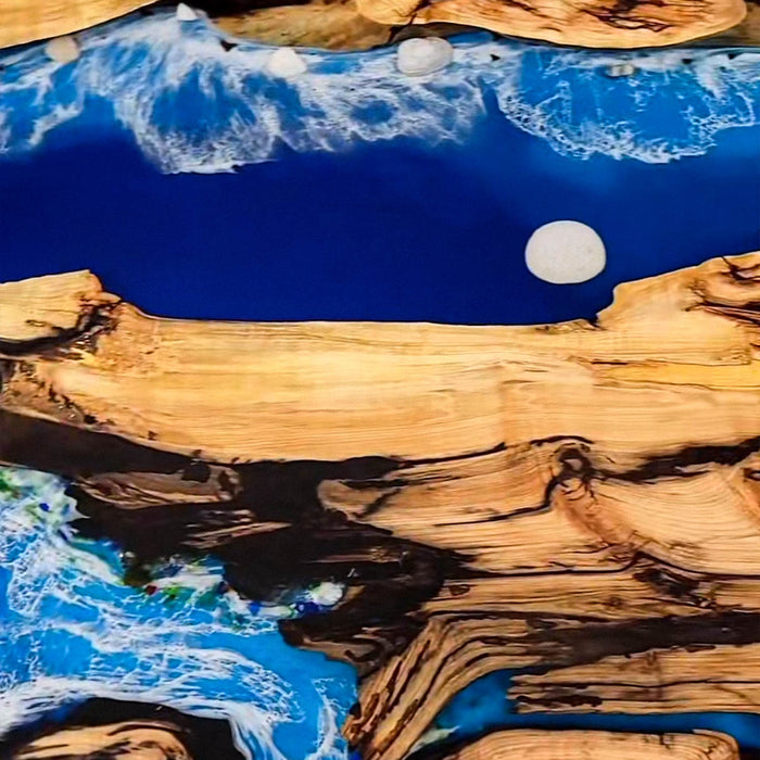 Luxury epoxy river table with olive wood and blue ocean resin
