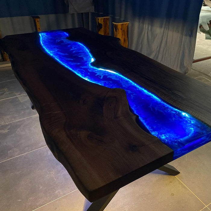 Luxury black walnut epoxy resin table with blue LED-lit river