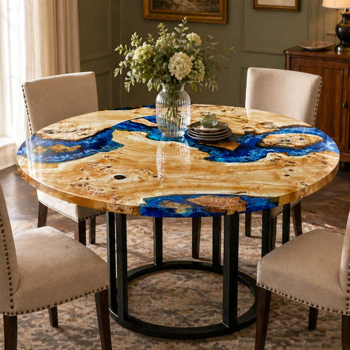Top view of a custom poplar burl table featuring artistic blue resin ocean waves.