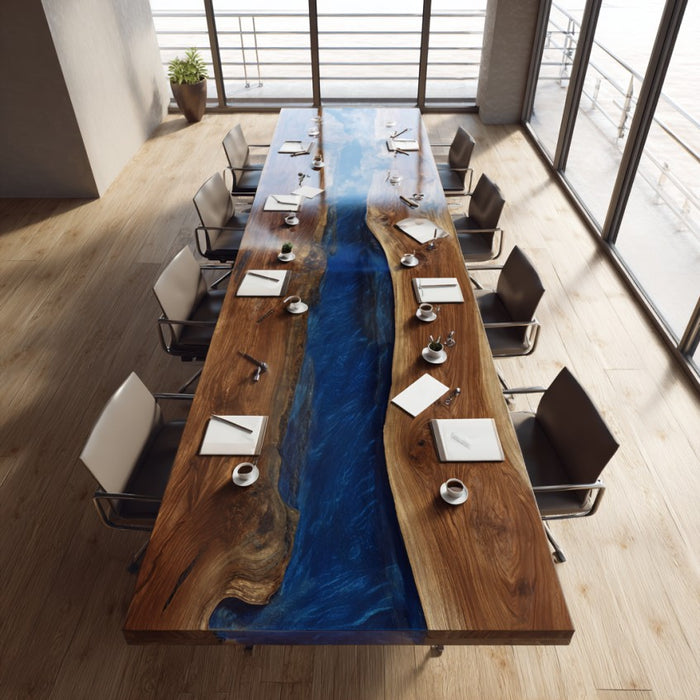 Long wooden table with a blue resin river in a modern office setting