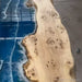 Luxury blue resin epoxy dining table handcrafted from poplar wood creating a unique statement piece for home furniture