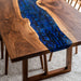 Luxury resin river table with deep ocean blue tones