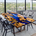 Luxury burl wood and blue epoxy resin dining table in modern living space