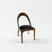 Wooden chair with a black cushion on a white background